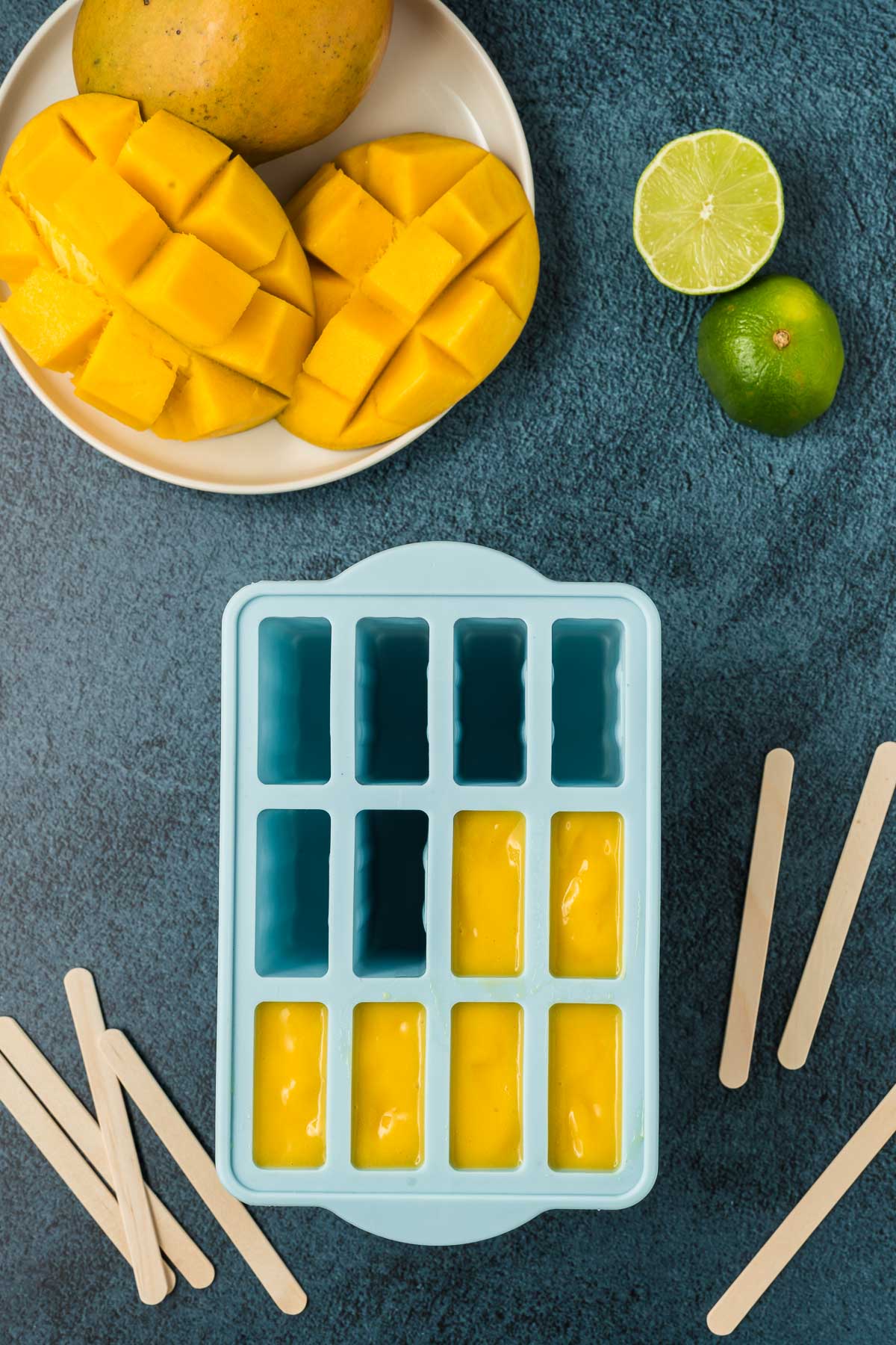 Mango puree in popsicle molds