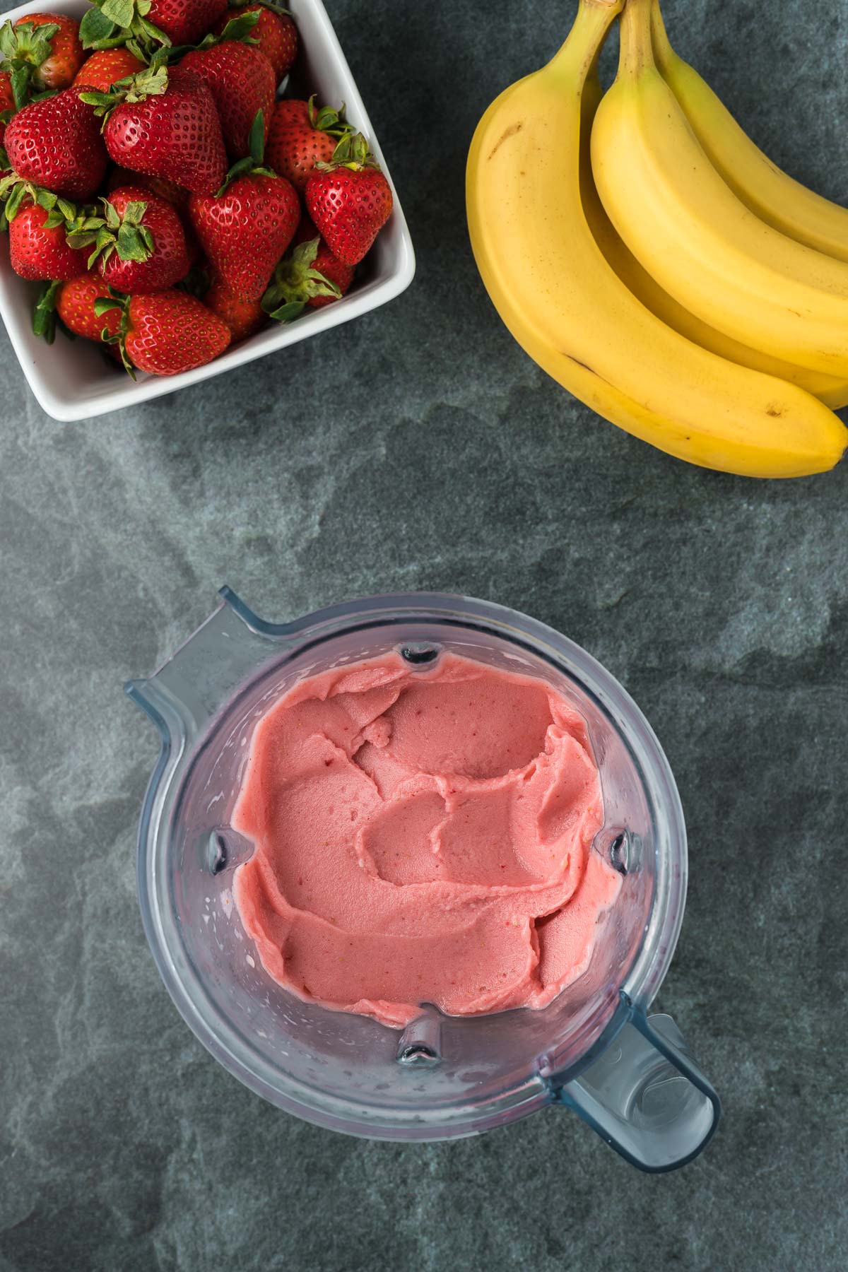 Strawberry banana smoothie bowl in a blender 